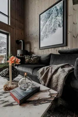 a living room with a couch and a table at Two-Storey Penthouse By Hemsedal Ski Resort in Hemsedal