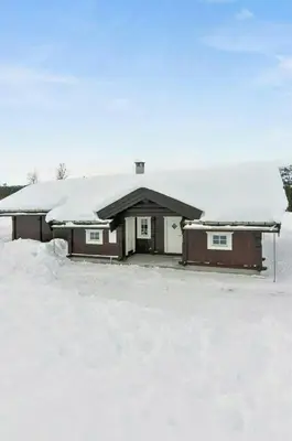 a house with snow on top of it at Mountain Cabin With Cinema Near Synnfjellporten in Nord Torpa