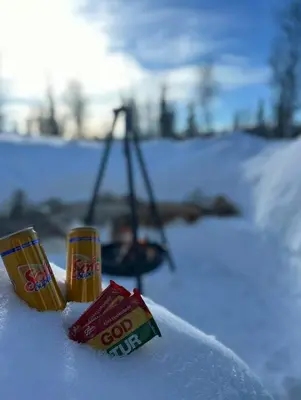 two candy canes in the snow next to a swing at Mountain Cabin With Cinema Near Synnfjellporten in Nord Torpa