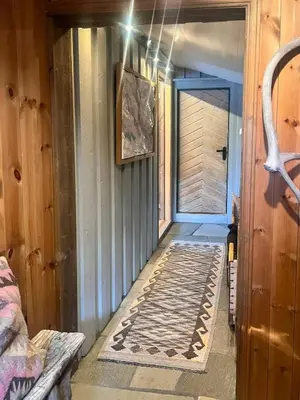 a hallway of a house with a rug on the floor at Wonderful Cottage For Active Families In Hemsedal in Hemsedal