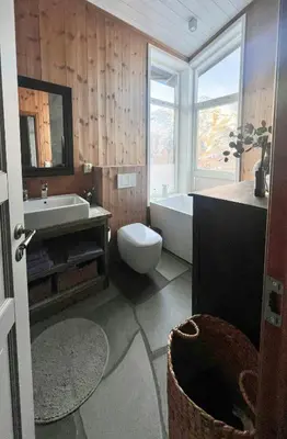 a bathroom with a tub and a toilet and a sink at Wonderful Cottage For Active Families In Hemsedal in Hemsedal