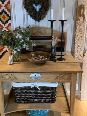 a wooden table with two candles and a basket on it at Modernised Cabin By The Ski Lift In Hovden in Bykle