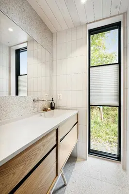 a bathroom with a sink and a large window at Stylish Cabin Near Oppdal Ski Centre in Oppdal