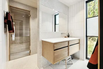a bathroom with a sink and a mirror at Stylish Cabin Near Oppdal Ski Centre in Oppdal