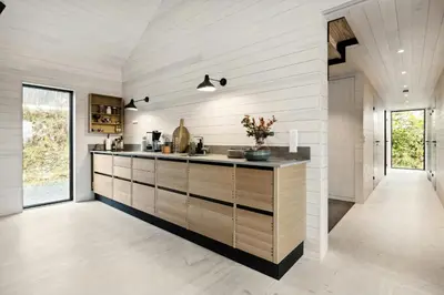 a kitchen with white walls and a counter top at Stylish Cabin Near Oppdal Ski Centre in Oppdal