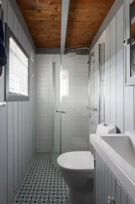 a bathroom with a toilet and a sink and a shower at 6 Bed traditional mountain cabin in Geilo - close to skiing and hiking in Hol