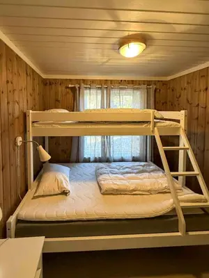 a bedroom with two bunk beds and a window at Cabin Near Ski Trails In Tempelseter in Eggedal