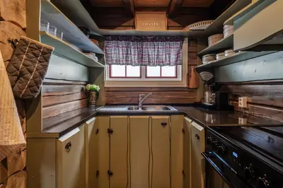 a kitchen with a sink and a window at Charming cabin by Hallingskarvet ski center in Hol