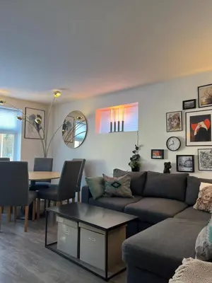 a living room with a couch and a table at Prime Location - Cozy and Big House in Vossevangen