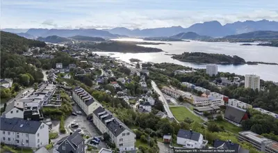 an aerial view of a town next to a body of water at Modern and central apartment with a view in Ålesund