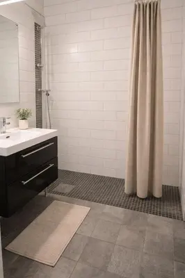 a bathroom with a shower curtain and a sink at Grandma Guest House, Rena Near Ski, Biking, River summer camp in Åmot