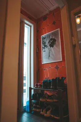 a room with a bunch of shoes on a wall at Close to cross-country skiing, slalom slope and mountains - Soltun Geilo in Hol