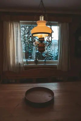 a chandelier hanging over a table in front of a window at Close to cross-country skiing, slalom slope and mountains - Soltun Geilo in Hol