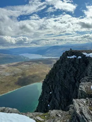a view from the top of a mountain with a lake at Timber Cabin With Hot Tub In Gjevilvassdalen in Oppdal