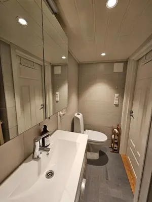 a bathroom with a sink and a toilet at Mausund- Øyperla i havet! Egen båtplass ved hytta! in Frøya