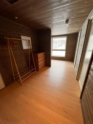 a room with a wooden floor and a window at Kikut1010 Skurdalsvegen 107 in Hol