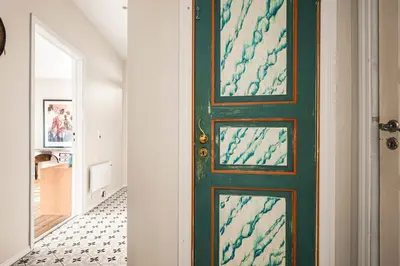 a green door in a hallway with a tile floor at A Dream Home with Spectacular Views - NEW! in Bergen
