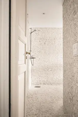 a bathroom with a shower in a brick wall at A Dream Home with Spectacular Views - NEW! in Bergen