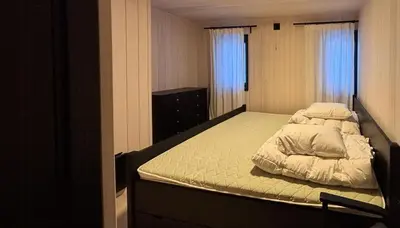 a bedroom with a bed with two pillows on it at Architect Cabin With Ski-In Near Trysil in Trysil