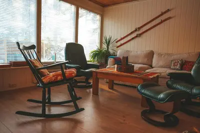 a living room with chairs and a couch at Close to cross-country skiing, slalom slope and mountains - Soltun Geilo! in Hol