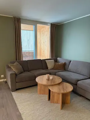 a living room with a couch and two tables at Modern apartment in Raufoss in Raufoss