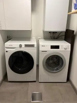 a laundry room with a washer and a dryer at Modern apartment in Raufoss in Raufoss