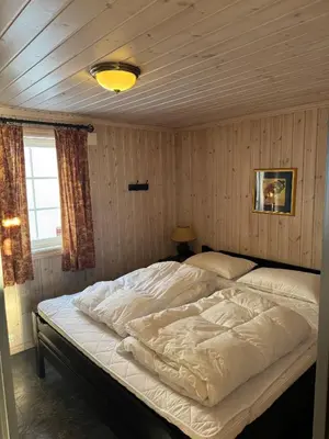 a bedroom with a large bed in a room at Cozy ski in & out cabin Hemsedal in Hemsedal