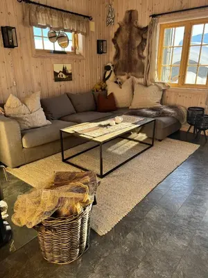 a living room with a couch and a coffee table at Cozy ski in & out cabin Hemsedal in Hemsedal