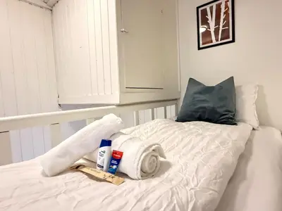 a bed with towels and other items on it at Pellan in Surnadal