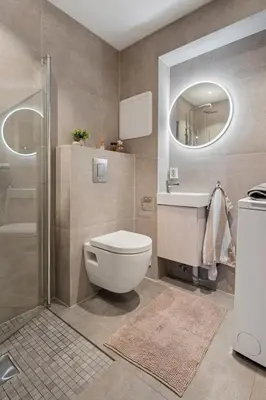 a bathroom with a toilet and a sink and a shower at Apartment with garage in the center of Lillehammer in Lillehammer