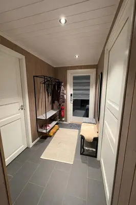 a room with a hallway with a room with a floor at Modern family cabin with ski in out, central location in Beitostølen in Beitostøl