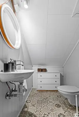 a bathroom with a sink and a toilet at Charming newly renovated house in city centre in Verdal