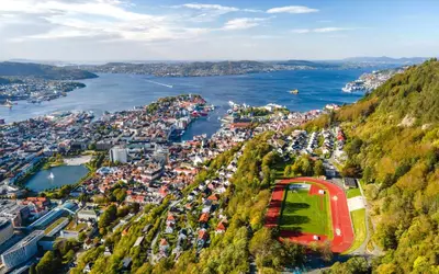 an aerial view of a town next to the water at Beautiful apartment in the heart of Bergen in Bergen