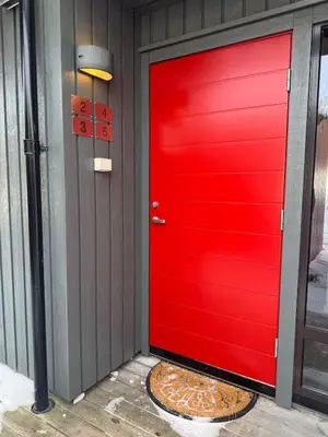 a red door in a house at New! Stay close to Hardangervidda & Vøringsfossen in Eidfjord