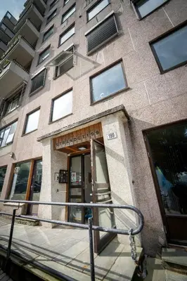 a building with a staircase leading to the entrance to a building at Ultra central flat with balcony in Bergen
