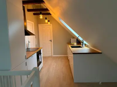 a kitchen with a sink and a counter top at Top Appartment in Bergen in Bergen