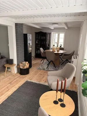 a living room with a couch and a table at Quiet detached house in Haukeli, modern and homey in Haukeligrend