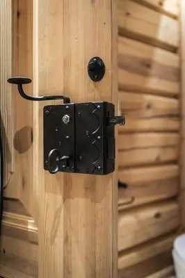 a wooden door with a black door knocker on it at Skogstad Lodge, Hemsedal in Hemsedal