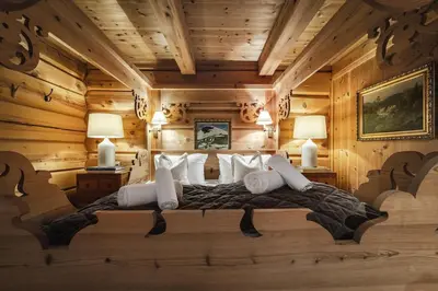 a bedroom with a bed in a log cabin at Skogstad Lodge, Hemsedal in Hemsedal
