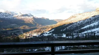 a view from the top of a mountain with snow at Skarsnuten Panorama 61, Hemsedal in Hemsedal