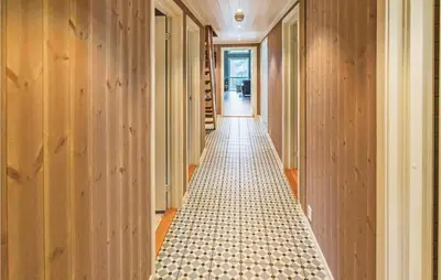 a hallway with a tiled floor in a house at 4 Bedroom Stunning Home In Skjolden in Skjolden