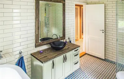 a bathroom with a sink and a mirror at 4 Bedroom Stunning Home In Skjolden in Skjolden