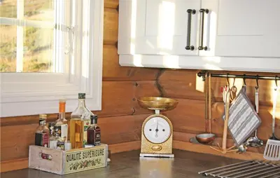 a kitchen counter with a clock on top of it at Holiday Home Hol With A Fireplace 02 in Hovet
