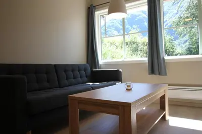 a living room with a couch and a coffee table at Setnes Feriesenter in Veblungsnes