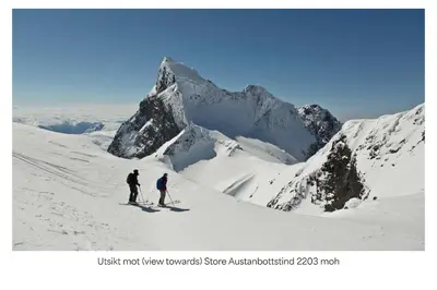two people skiing on a snow covered mountain at Turtagrø Hotel in Fortun