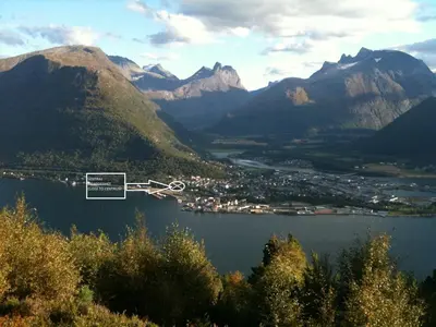 a view of a lake with mountains in the background at Villa Haudalan Åndalsnes in Åndalsnes