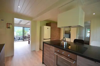 a kitchen with a counter top and a refrigerator at Villa Haudalan Åndalsnes in Åndalsnes