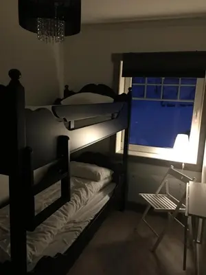 two bunk beds in a room with a window at Kvamseter Lodge in Kvamseter