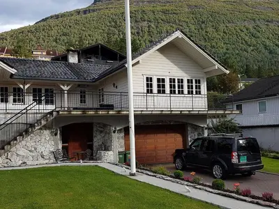 a car parked in front of a house at Aarnes house Stryn in Stryn