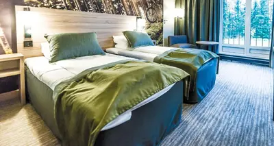 a hotel room with two beds in a room at Scandic Lillehammer Hotel in Lillehammer